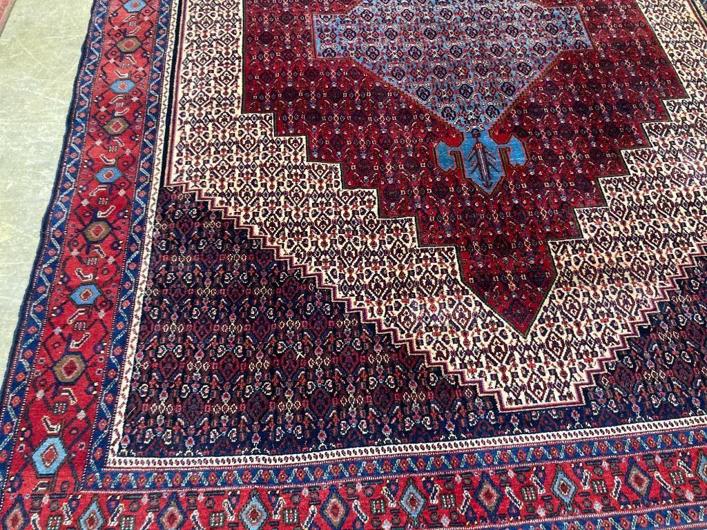 A Feraghan pattern red ground carpet, 320 x 250cm